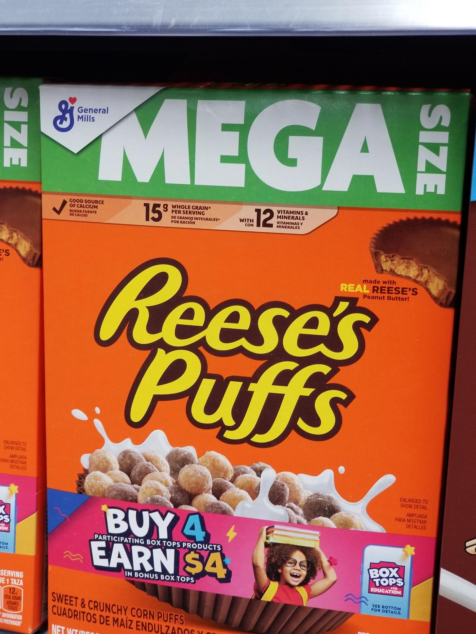General Mills Mega Size Reese's Puffs made with Real Reese's Peanut Butter, Sweet and Crunchy Corn Puffs.