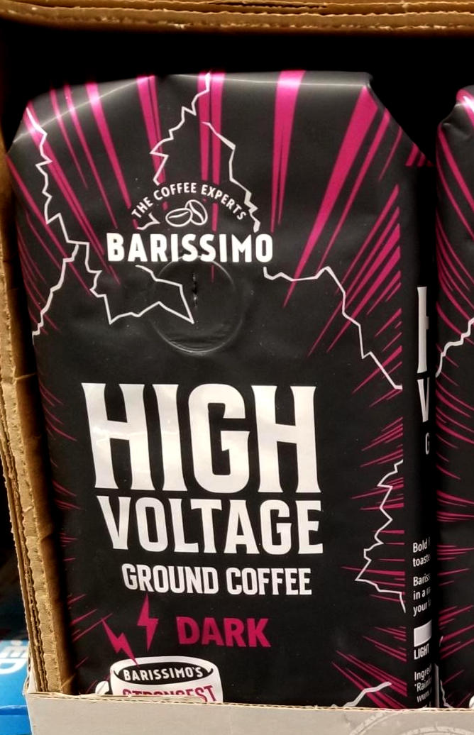 A bag of ground coffee, made by Barissimo, labeled High Voltage, Dark.