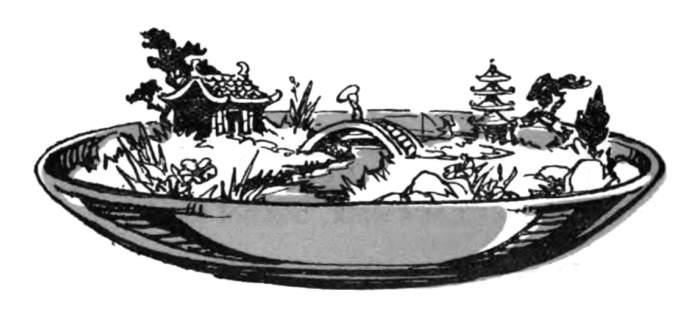A shallow bowl holds a Japanese landscape.