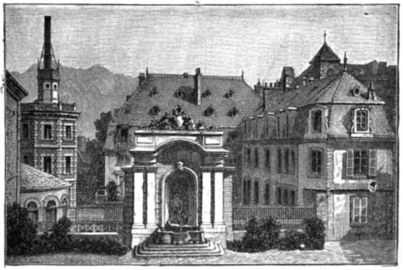 Buildings with moutains in the background.