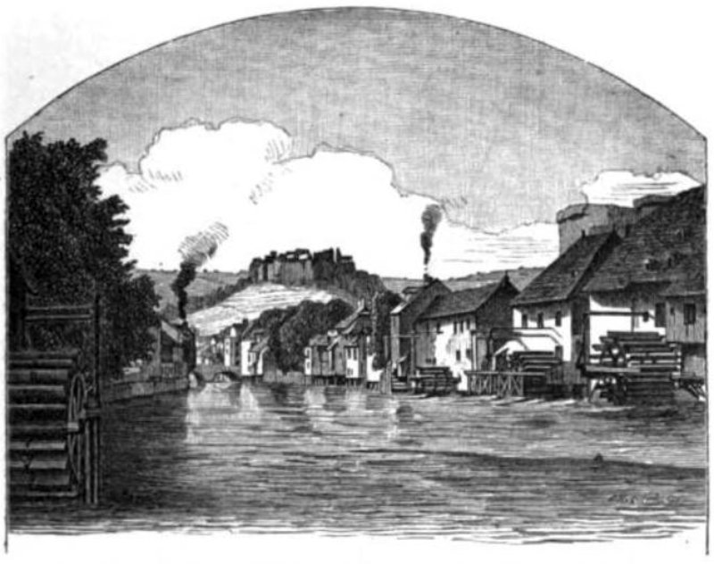 Buildings from which smoke emerges line a canal as does a waterwheel.