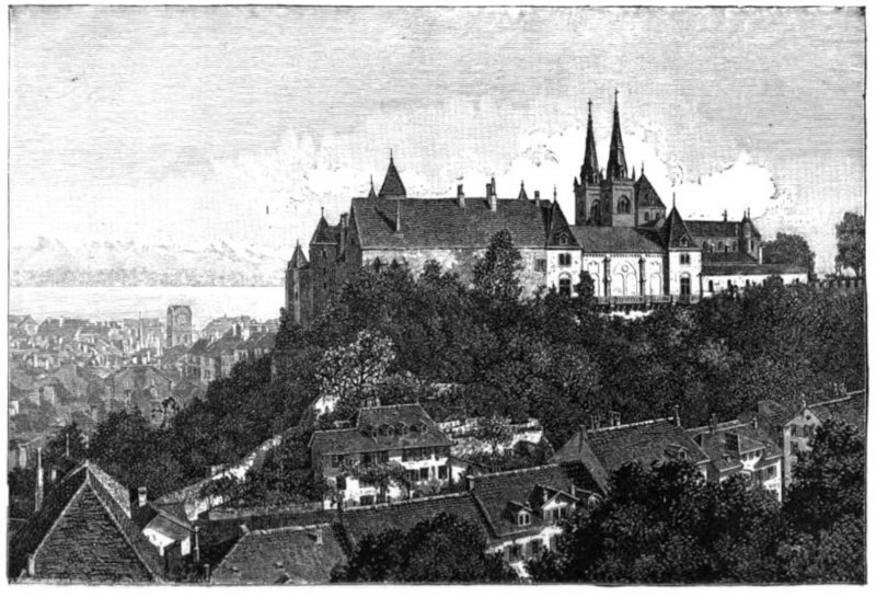 A large building at a high elevation enjoys a view overlooking other surrounding buildings.