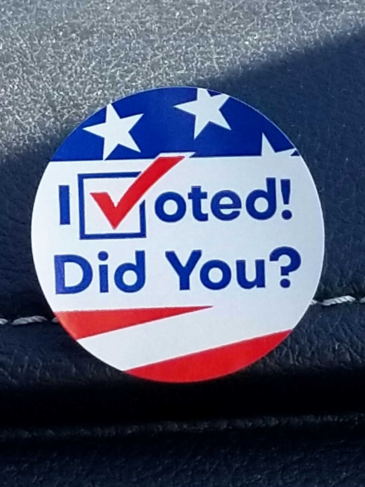 A sticker says "I Voted! Did You?" with the 'V' stylized as a check-mark.