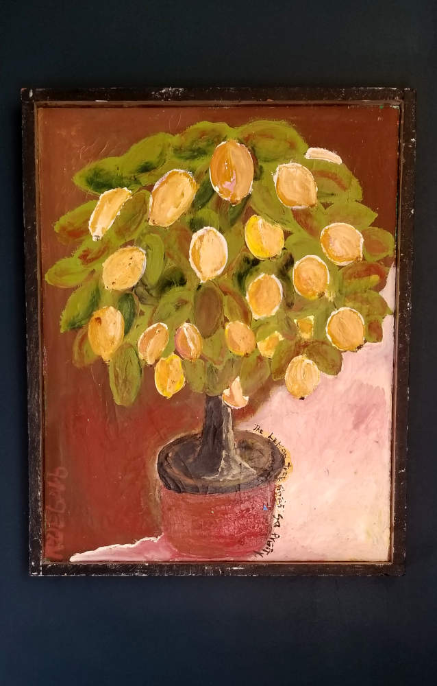 Lemon tree with lemons in a pot surrounded by words from the song.