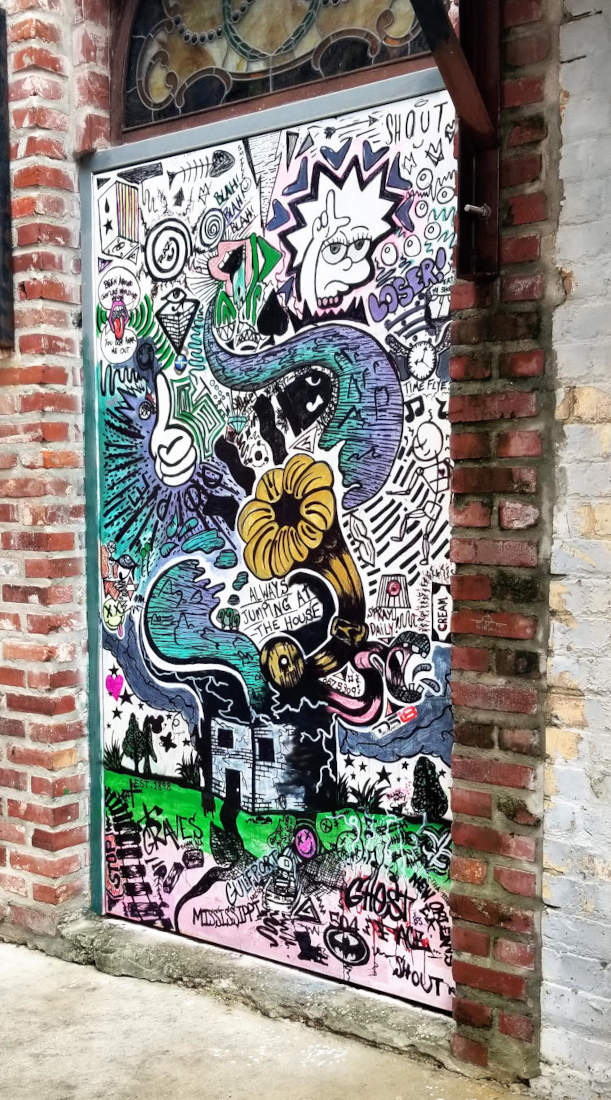 Mural, frenetic arrangment of cartoon elements.